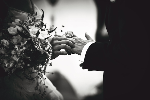black and white photo of the ring exchange - wedding photo by Australia based wedding photographer Natasha Du Preez